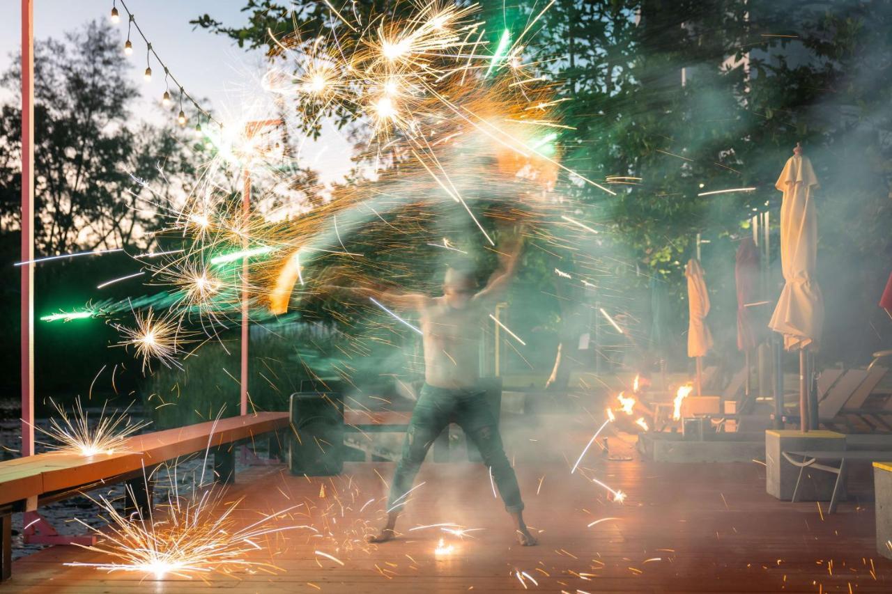 Cassia Phuket, Part Of Banyan Group Bang Tao Beach (Phuket) Exteriör bild A man dancing with fireworks